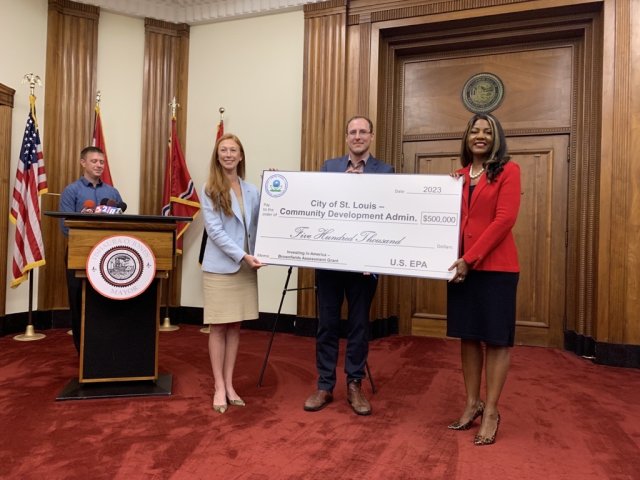 Group photo of ceremonial check presentation