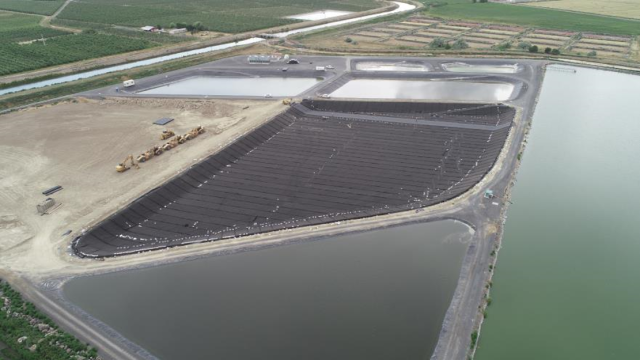 The figures is a photo of the brine pond, where brine is managed by evaporation. Salty brine is produced as a waste product of the reverse osmosis treatment step.