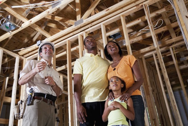 Family at a home construction site.