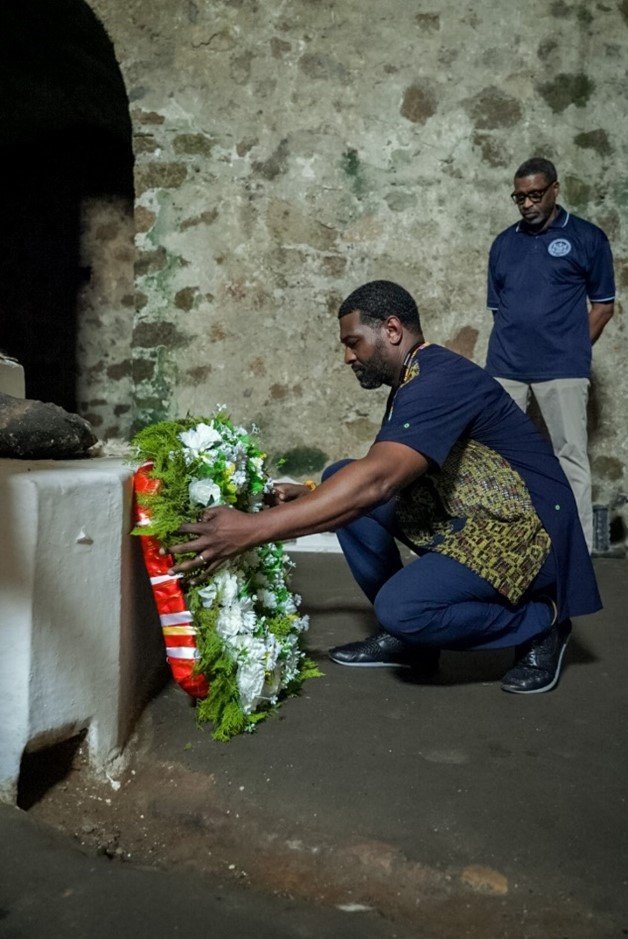 Administrator Regan lays a wreath in the dungeons to honor the enslaved people held at Cape Coast Castle. January 28, 2024 