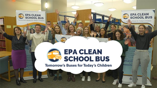 Group of people celebrating EPA Clean School Bus program