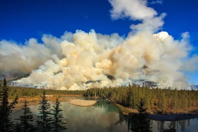Smoke from a wildfire over a lake