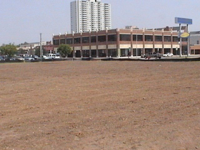 Large dirt field that was once a contaminated site that has been cleaned up and is ready for reuse and redevelopment.