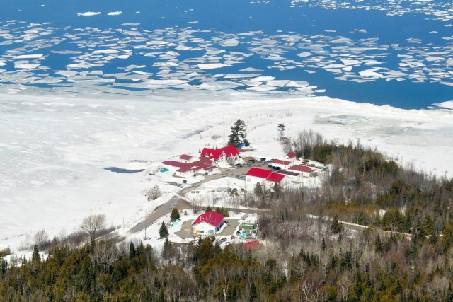 Aerial view of the USGS Great lakes Science Center Hammond Bay Biological Station with lake ice.