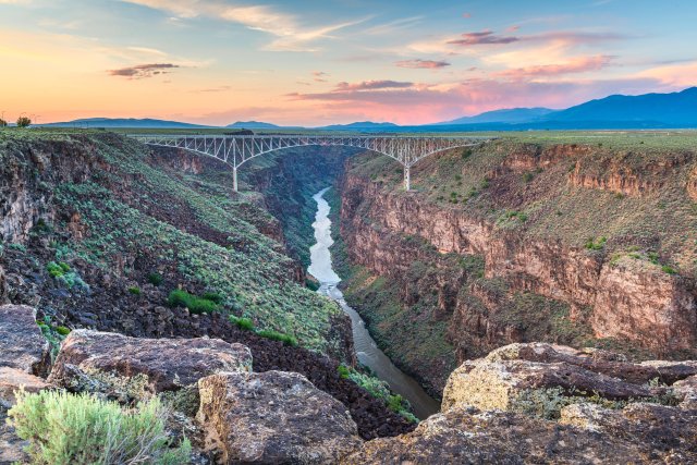 Bridge crossing over Rio Grande in valley below.