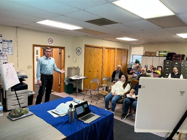 Photo of EPA representative speaking at a community meeting to address site cleanup progress on March 12, 2025, in Falls Creek Borough, PA.