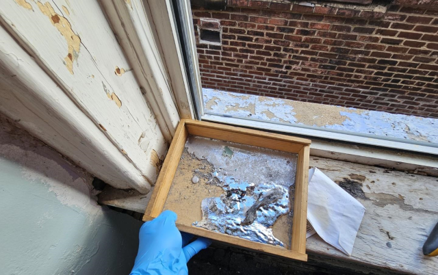 Spilled elemental mercury in a drawer.