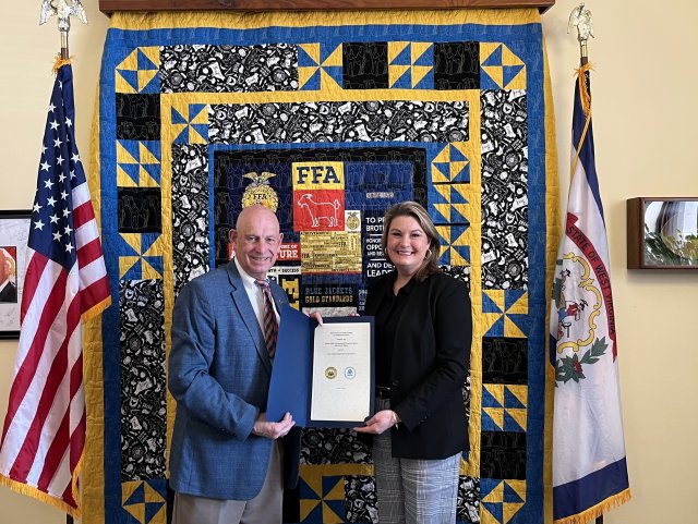 EPA Mid-Atlantic Regional Administrator Amy Van Blarcom-Lackey and West Virginia Agriculture Commissioner Kent Leonhardt pictured holding the signed MOU at Leonhardt's office in the West Virginia Capitol Building in Charleston.
