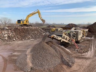 Image of heavy machinery in a barren field.