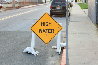 High water sign placed on a road