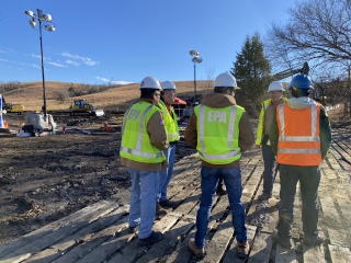 EPA personnel speak with PHMSA Accident Investigator Ky Nichols at the excavation site on the scene of the TC Energy pipeline rupture response.