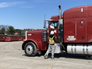 EPA responder logging a truck leaving site