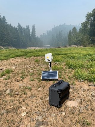 WSMART solar powered sensor system setup near the fire to monitor PM2.5 and carbon monoxide. Photo by Amara Holder.