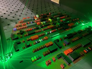 Model City in a wind tunnel illuminated in a green light