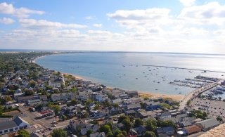 A landscape view of Cape Cod looking onto the water.