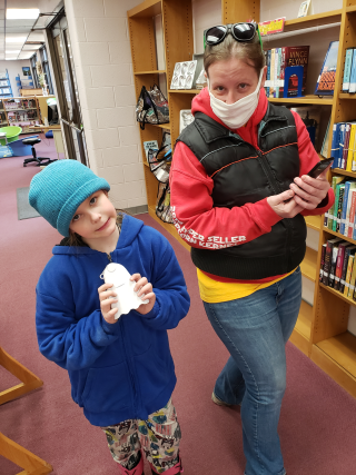 Two air sensor loan program participants with an air sensor.