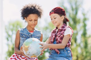 image that Kids holding globe