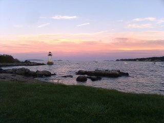 Salem Sound, a coastline with a lighthouse in the distance.