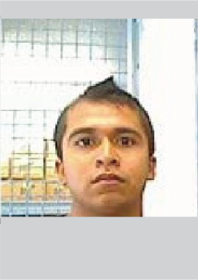 closeup of young latino male with pointy "cowlick" hair on top