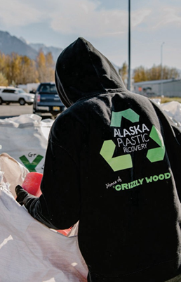 PKS Employee sorting plastic waste