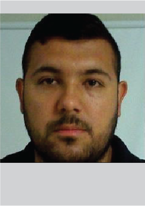 closeup face of latino male with short hair, and short beard with mustache