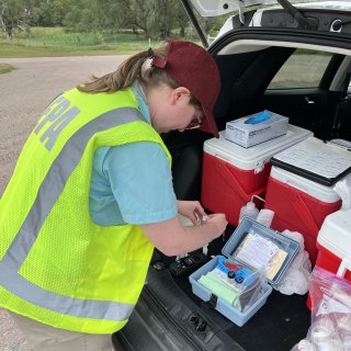 An EPA Region 7 scientist takes water samples at the Santee Sioux Nation in Niobrara, Nebraska.