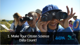 A group of kids participating in citizen science with binoculars outdoors