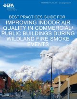 Cover page of building wildfire guide that shows image of a large smoke pillar looming over a town road.