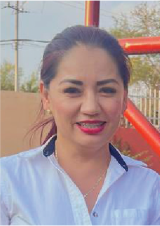 smiling woman with dark brown hair wearing a white shirt with blue trim at collar